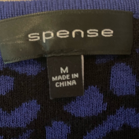 Spense Medium Midi Length knit Dress in a black and royal Blue print. - Picture 7 of 11